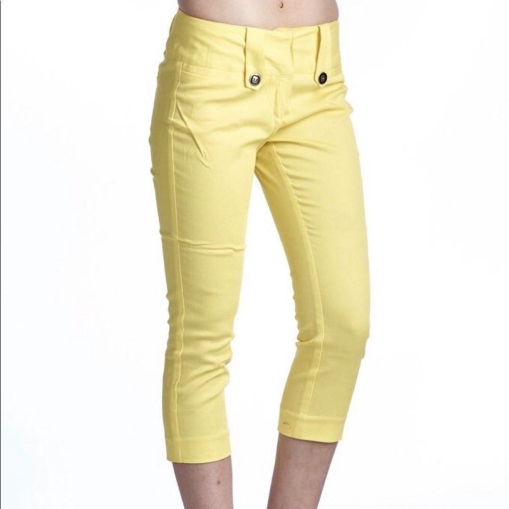 Yellow Capris with lots of details.